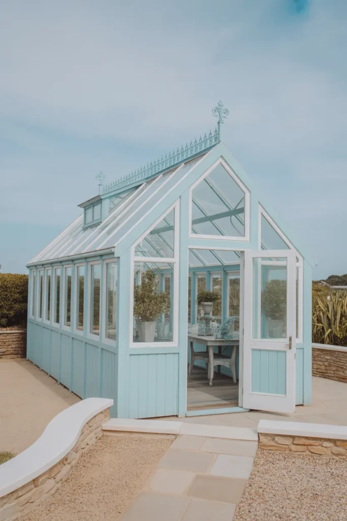   Coastal Greenhouse with Blue Accents